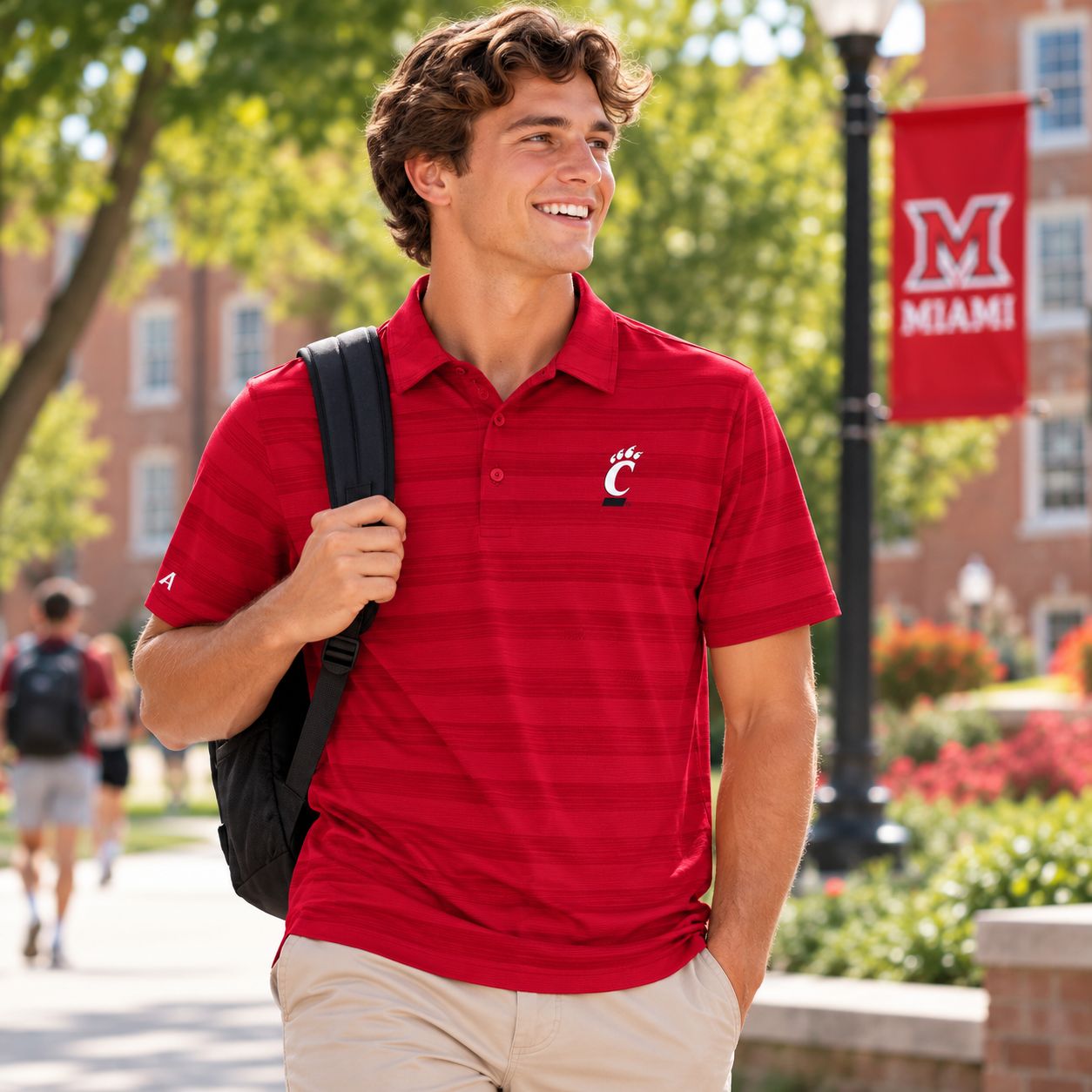 Antigua Men's University of Cincinnati Bearcats Red Striped Polo