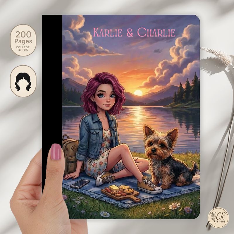 Personalized composition notebook featuring an illustrated girl and dog at a lakeside sunset picnic with custom name on cover