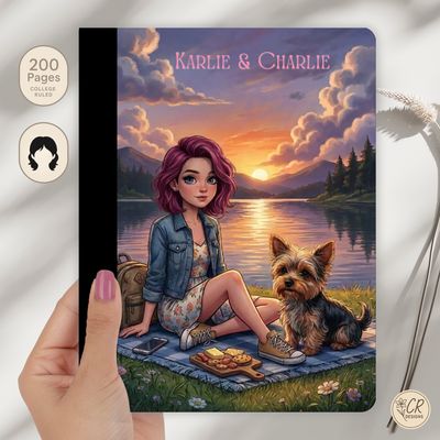 Personalized composition notebook featuring an illustrated girl and dog at a lakeside sunset picnic with custom name on cover