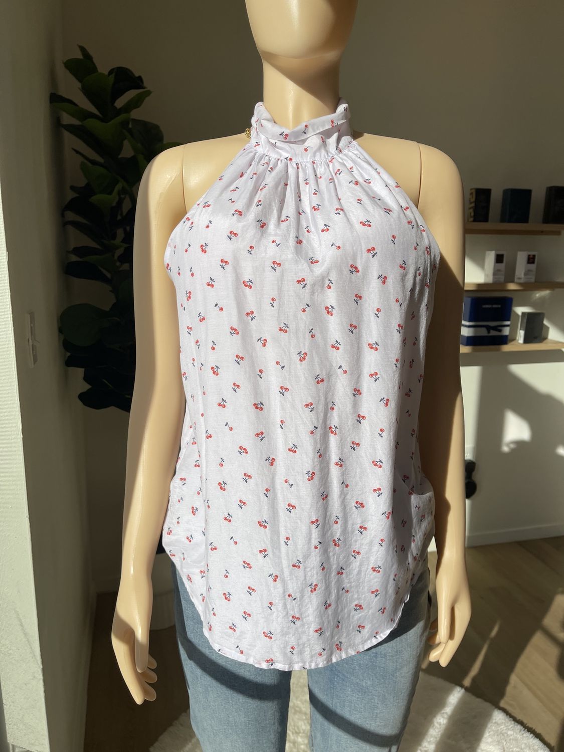 sleeveless turtleneck cherry print blouse