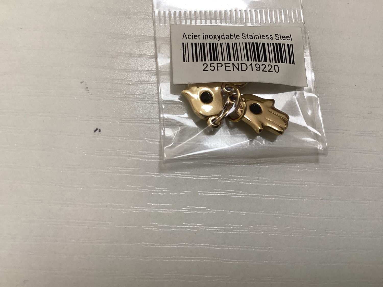 Gold hand pendant