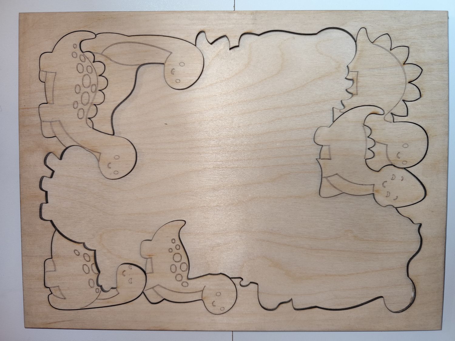 Puzzle dla dzieci Dinozaury – drewniane, do malowania, 22 el. + ramka