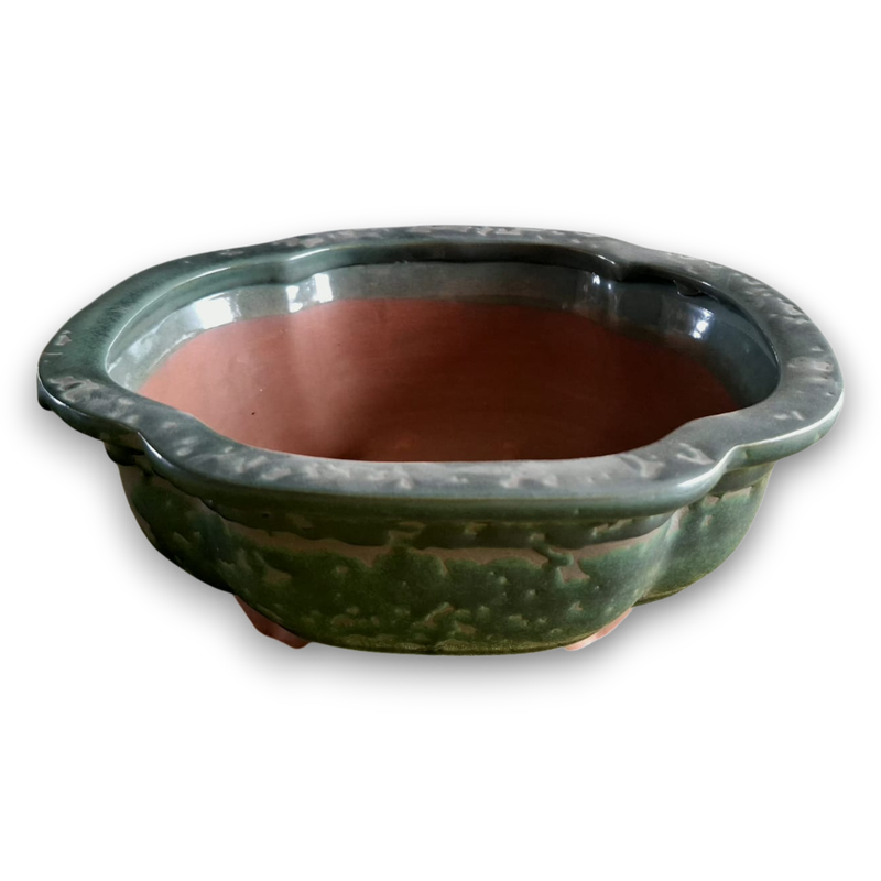 Emerald glazes drift like mist across ancient valleys