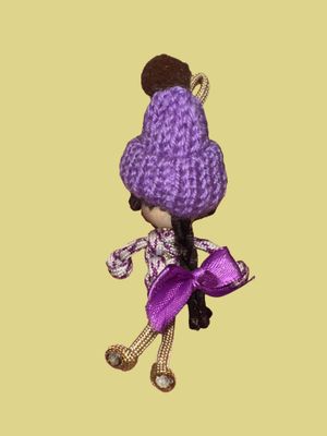 Little Purple with bobble hat and bow