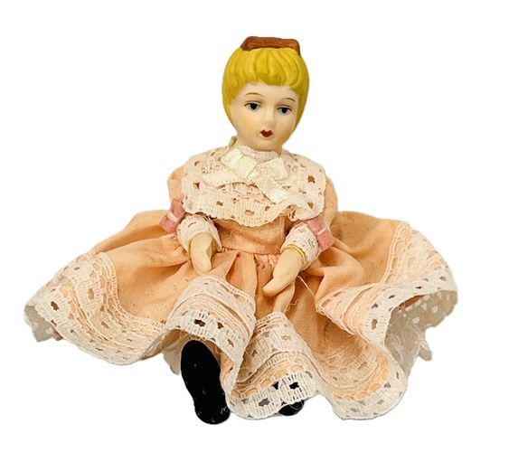Blonde girl in peach and white dress doll1026