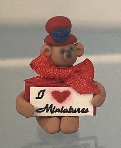 Brown Bear in Red Hat Holding a 'I Love Miniatures' Sign Beary1E