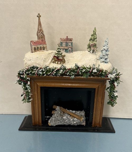 Christmas Fireplace with Village in the Snow and Garland mc031781