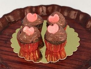 Chocolate Cupcake with candy heart and red cup jc113207