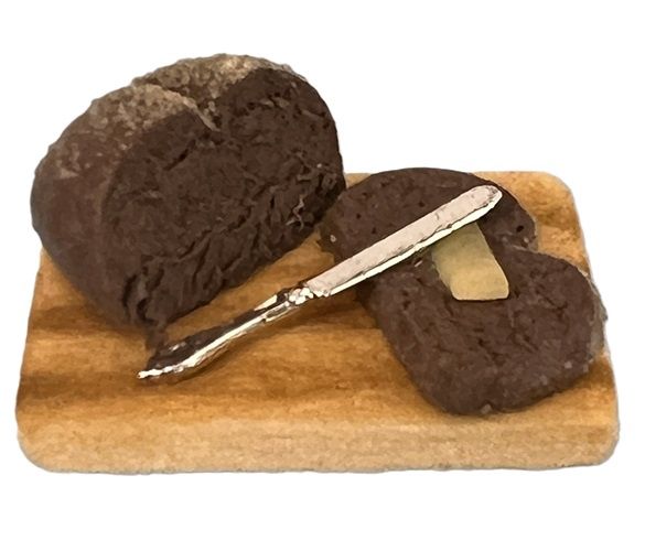 Dark Loaf of Bread on Board 940882