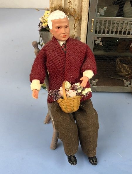 Gentleman Sitting with a Basket of Fresh Flowers mc05263