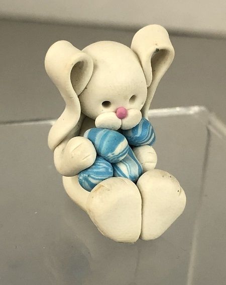 Rabbit Holding Blue and White Eggs mc03203
