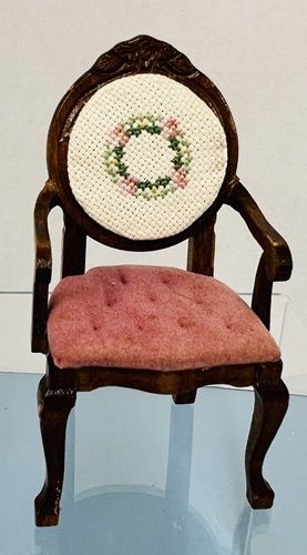 Pink cushion and cross stitched back on mahogany chair mc1515x