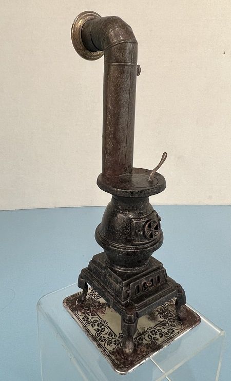 Rusty Farmhouse Pot Bellied Stove with red light inside mn192