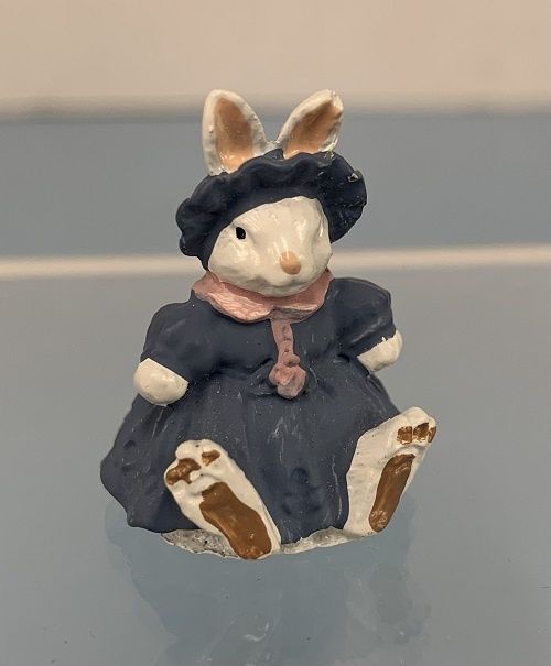 Sitting Girl Bunny in Blue Dress ala770px