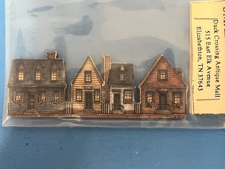 Set of four row houses on a wood backing ala835