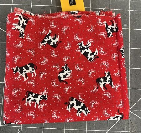 Small cow on red background fabric fabric23
