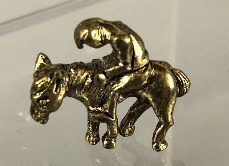 Slouching Man Riding a Horse MC01858