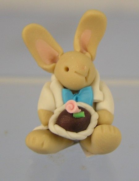 Small Bunny Holding Chocolate Egg ala218