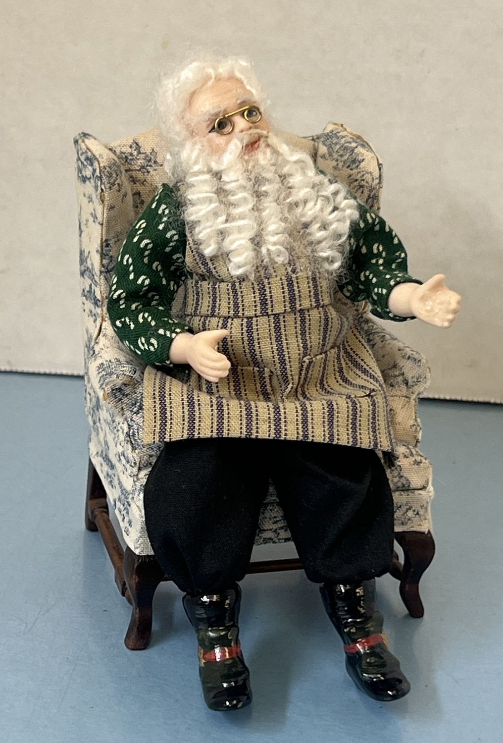 Santa in Candy Cane Shirt and striped apron