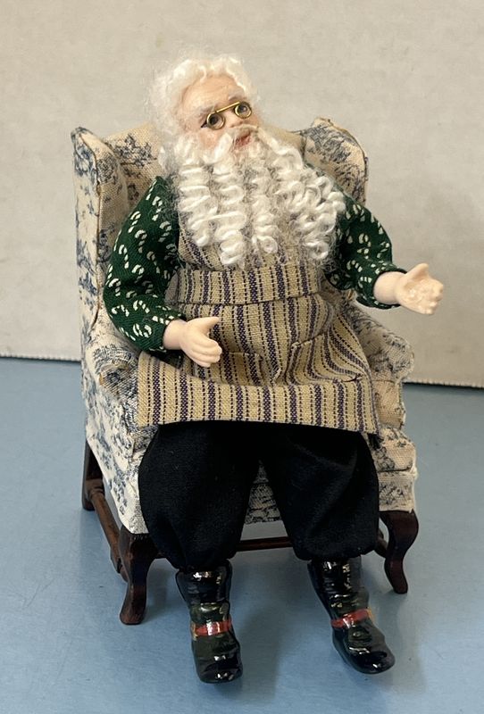 Santa in Candy Cane Shirt and striped apron