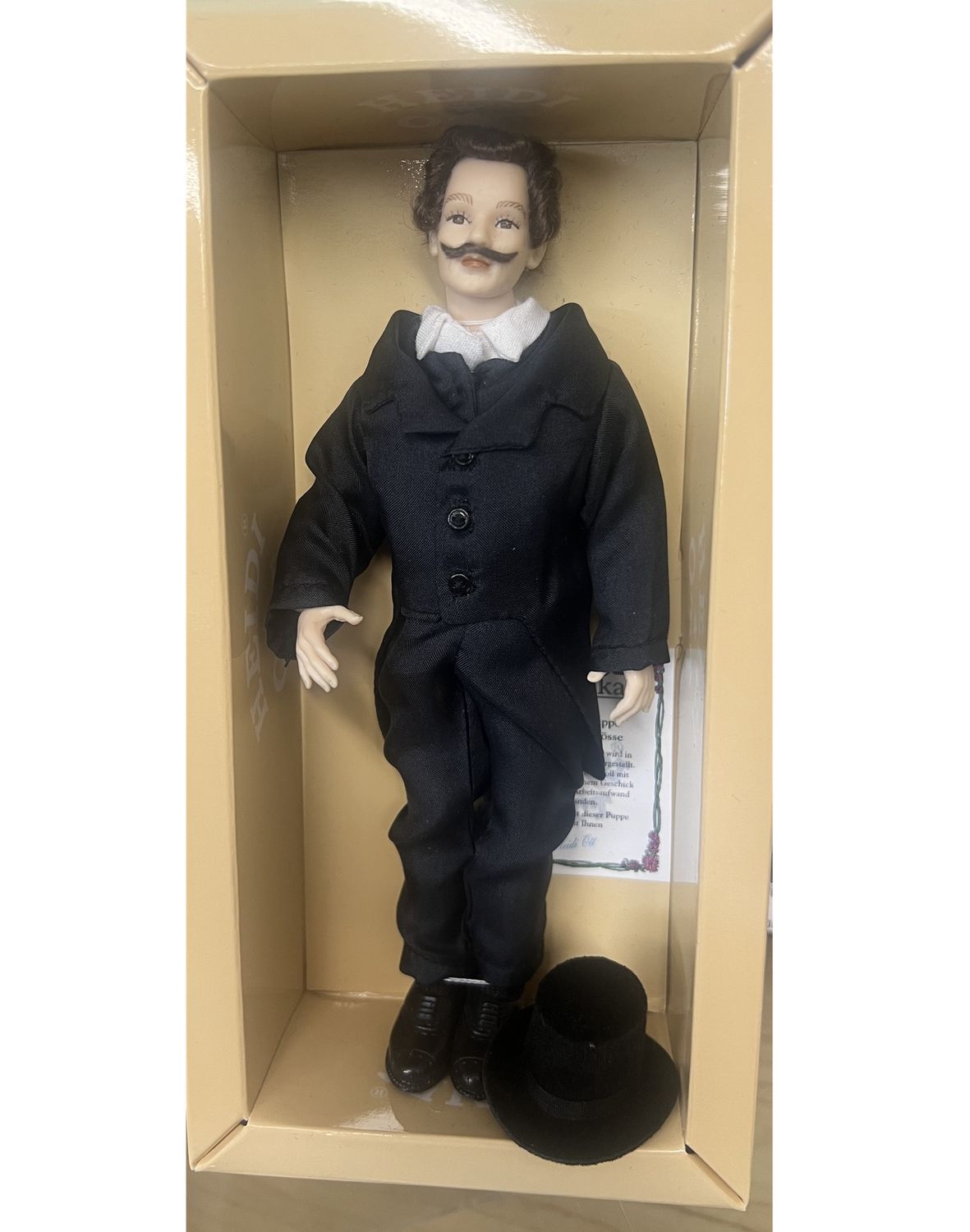 Gentleman with top hat in black suit