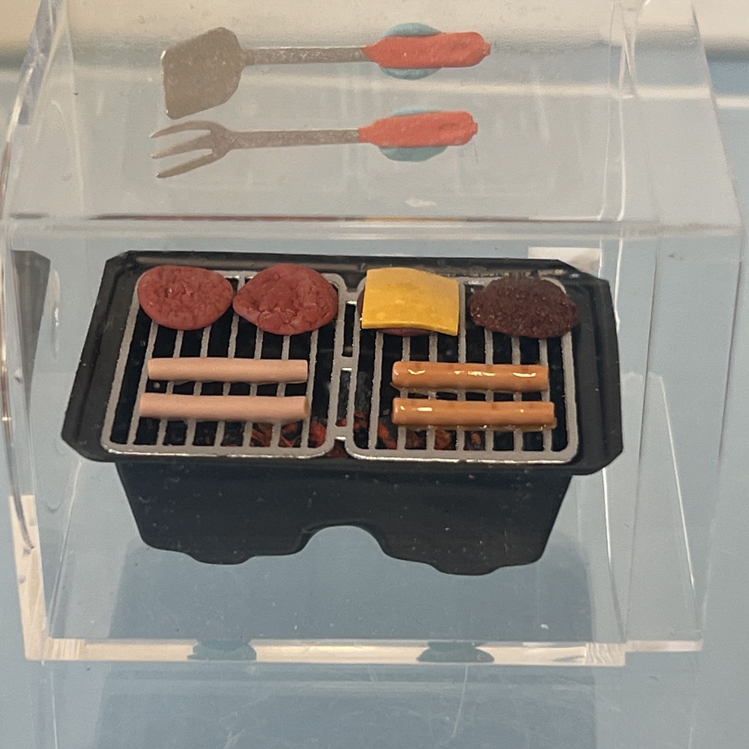 Grill with hamburgers and hotdogs