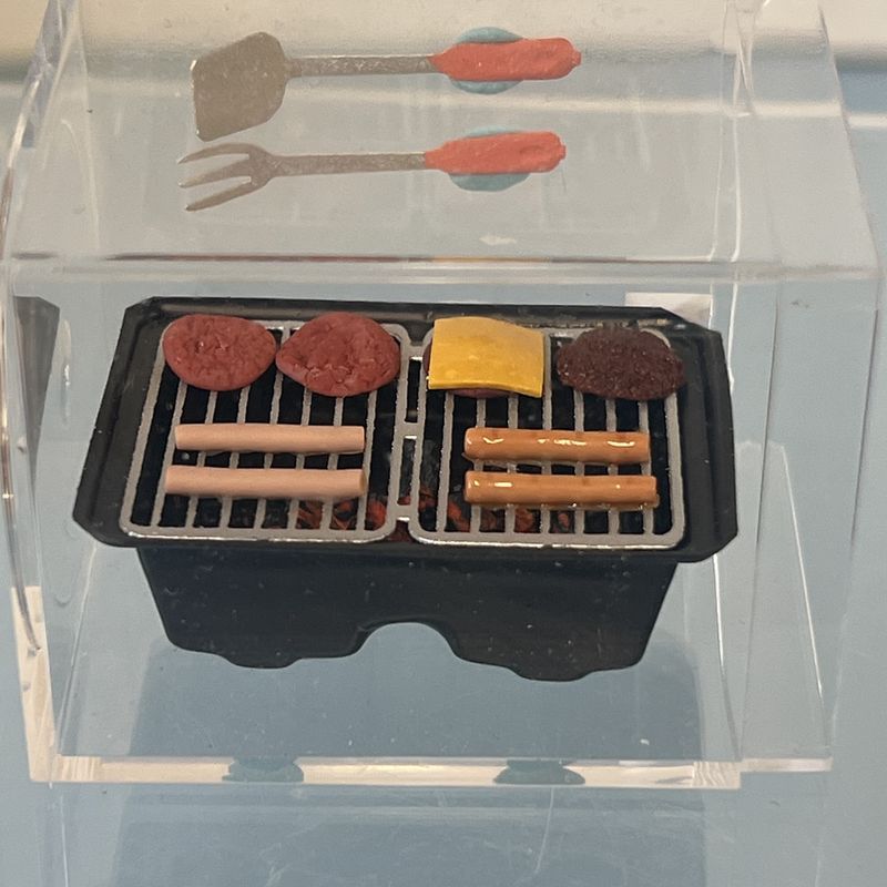 Grill with hamburgers and hotdogs