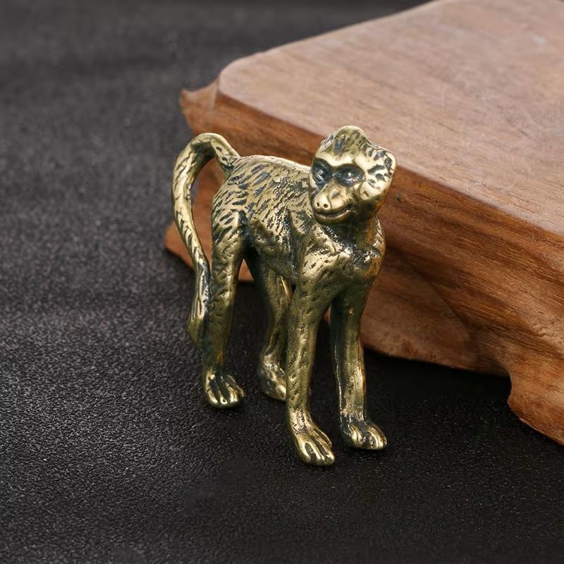 A Small Brass Figurine of a Monkey