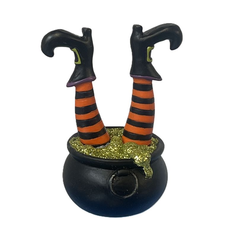Cauldron with witch's feet sticking up