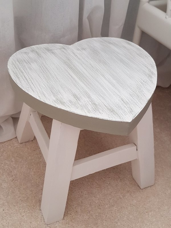 A cute wooden heart stool