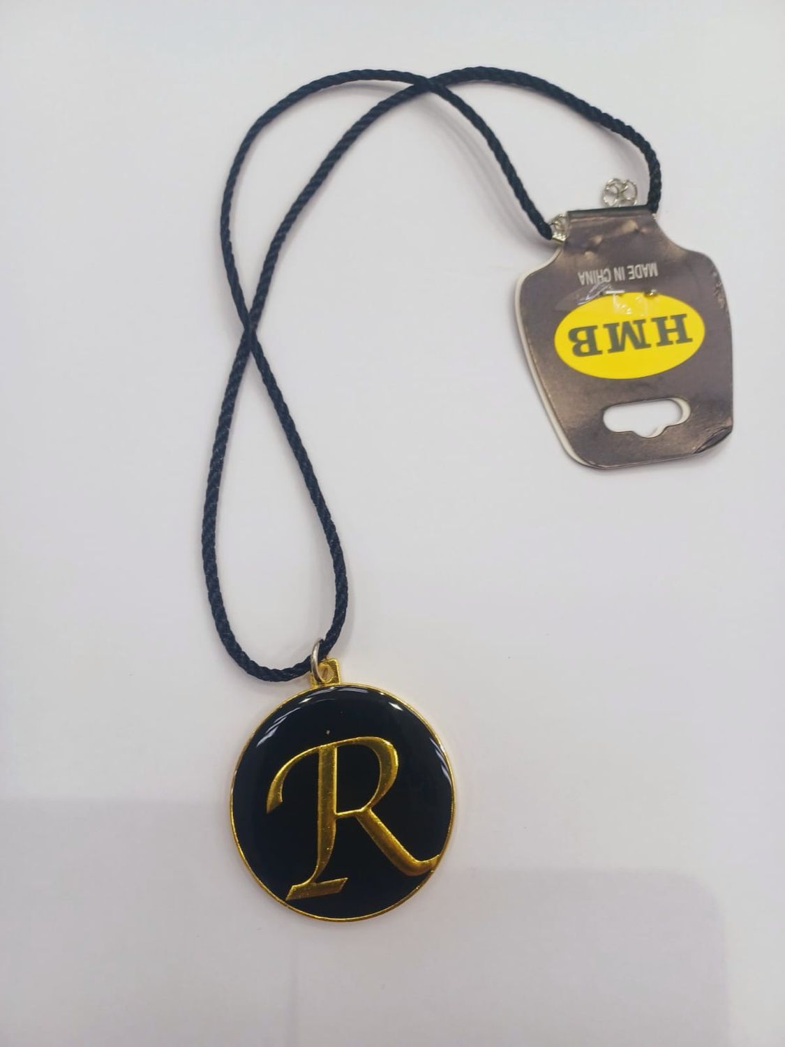 ‏علاقي مراية على شكل حرف R