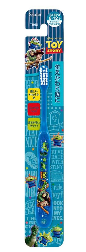 Elementary school student using toothbrush