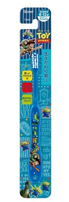 Elementary school student using toothbrush