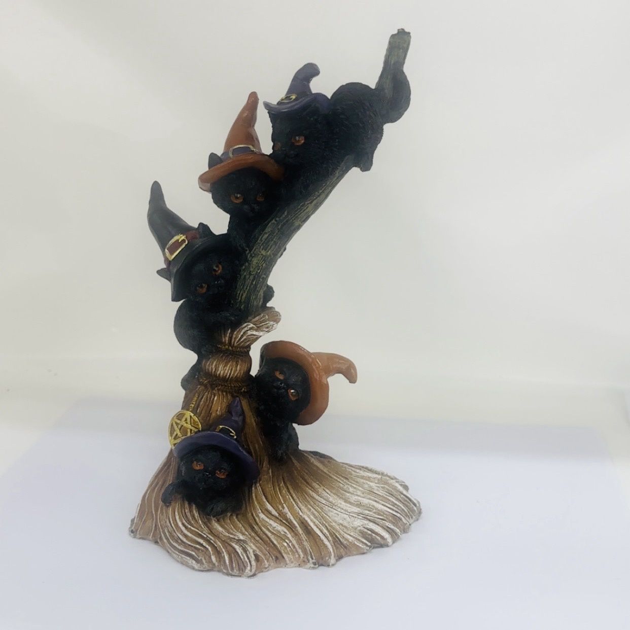 Witches cat climbing tree