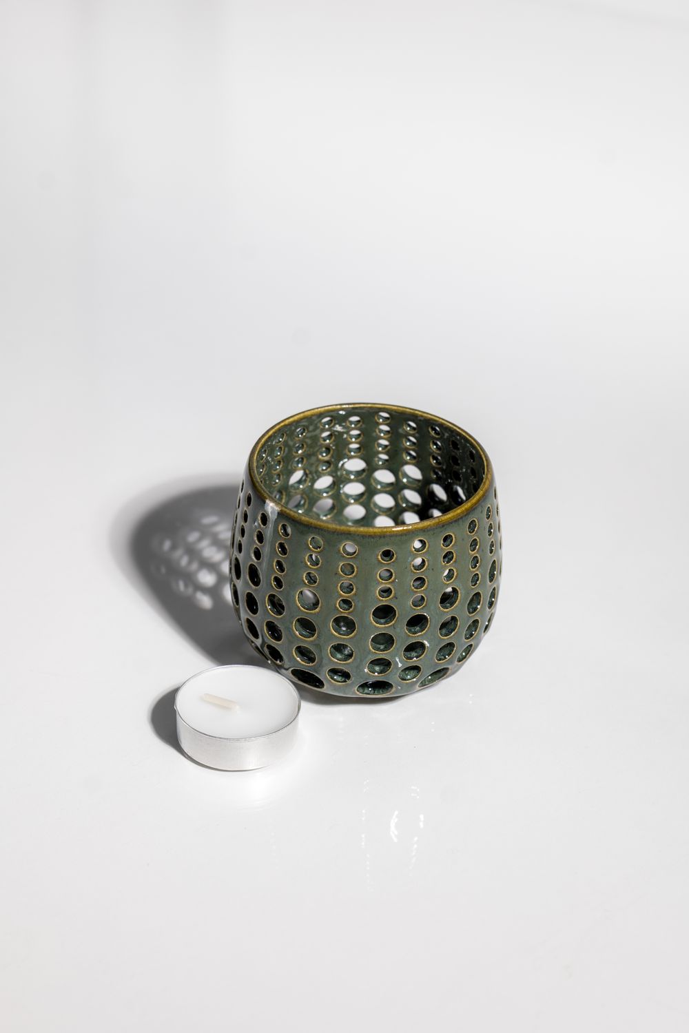 Pinterest worthy tealight candleholder handmade by ceramic artist that shines light through the walls