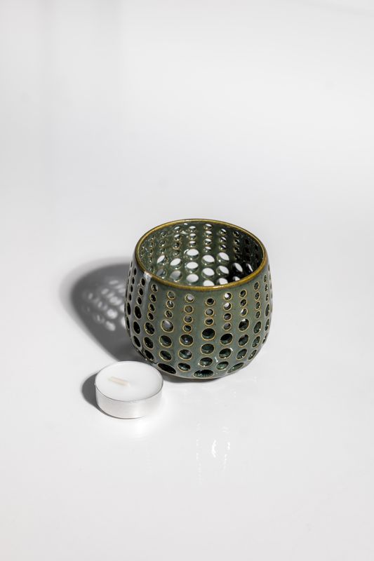 Pinterest worthy tealight candleholder handmade by ceramic artist that shines light through the walls