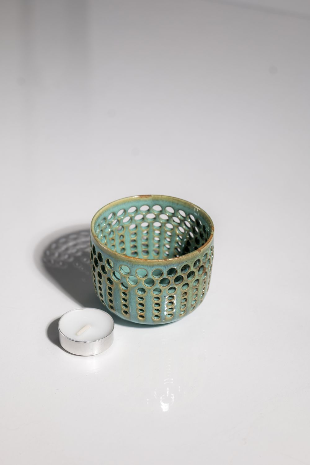 Cute teal and blue boho home decor accessory. Tealight candleholder handmade by local artist in the USA. CORTERRA clay