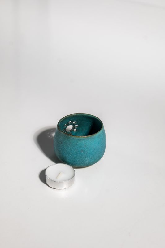 Jade green cutesy daisy ceramic candleholder. Handmade on the pottery wheel and individually carved into the stoneware. 