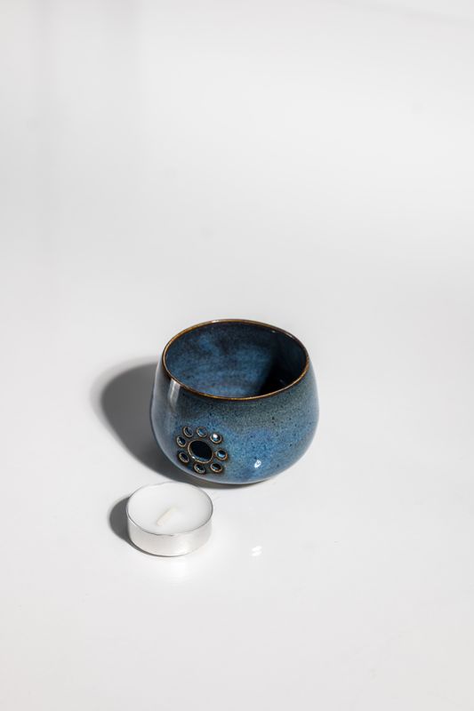 Daisy designed luminary candle holder for tealight candles. Handmade art from the pottery wheel at CORTERRA Clay