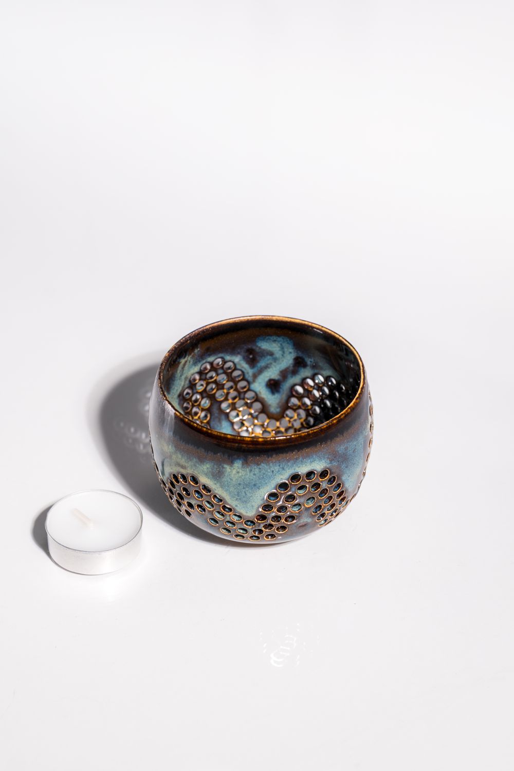 Gorgeous birthday gift for candle lover. Handmade ceramic tealight votive candle holder with brown base and blue glaze.