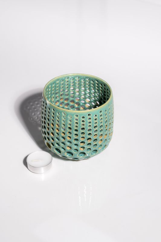 tall ocean breeze, marine-inspired ceramic candleholder ideal for ambient lighting in your cozy beach cottage. 