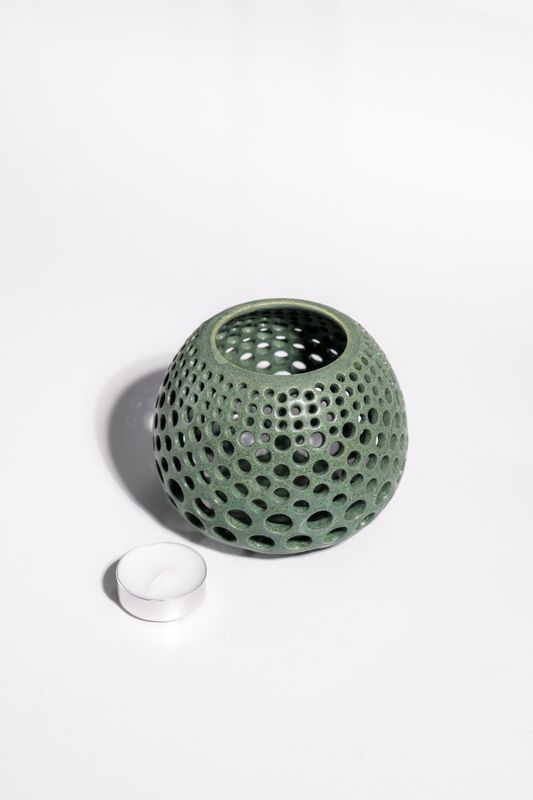 Ceramic tealight candle holder hand-carved into stoneware. Matte forest green color with safe glaze in kiln. 