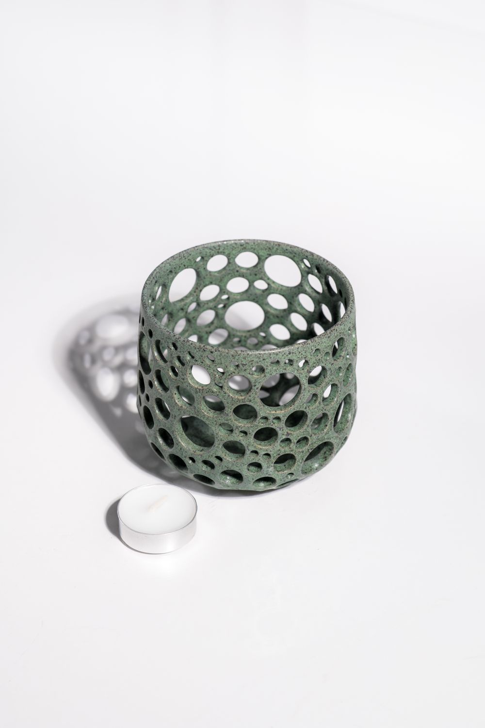 Organic and natural matte green ceramic tealight candleholder ideal for modern homes and ambient lighting,