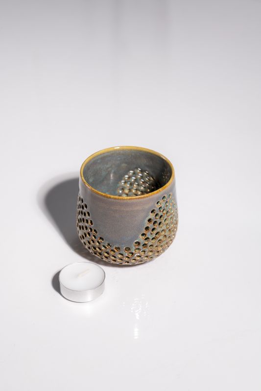 Ceramic candle holder with wave holes punch pattern, handmade by CORTERRA. Small batch ceramics for tealight candles. Blue