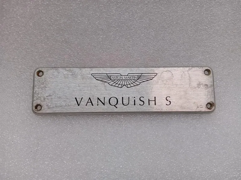 ASTON MARTIN VANQUISH S 04-07 V12 VANQUISH S LOGO DOOR POST PLATE