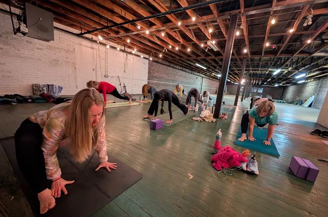 Gaston Gazette Article: Caroline Miller leads her yoga class above Ride-A-Bike