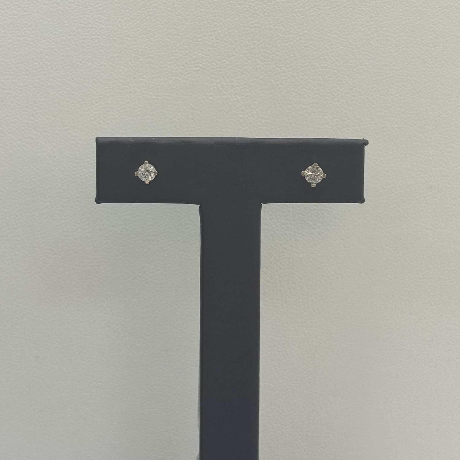 Diamond Stud Earrings.