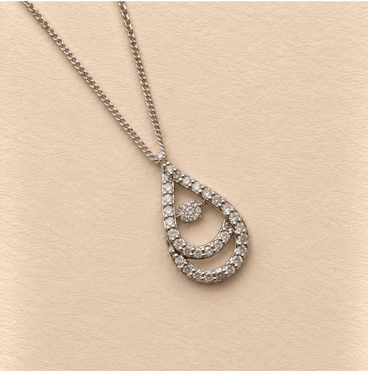 "Dancing Diamond" Teardrop Halo Pendant
