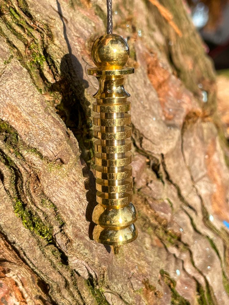 Pendule Isis-Osiris doré