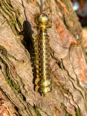 Pendule Isis-Osiris doré